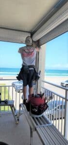 homeowner preparing property 30 days before hurricane season using a hurricane checklist